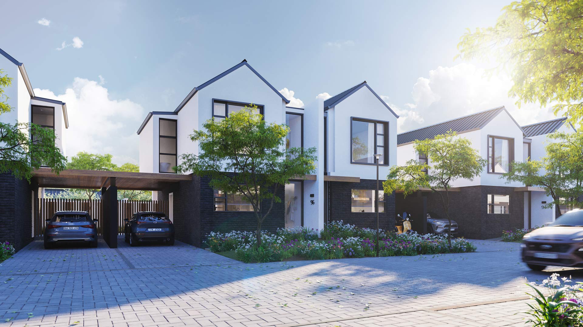 A group of townhouses with parking bays and greenery within the secure lifestyle estate